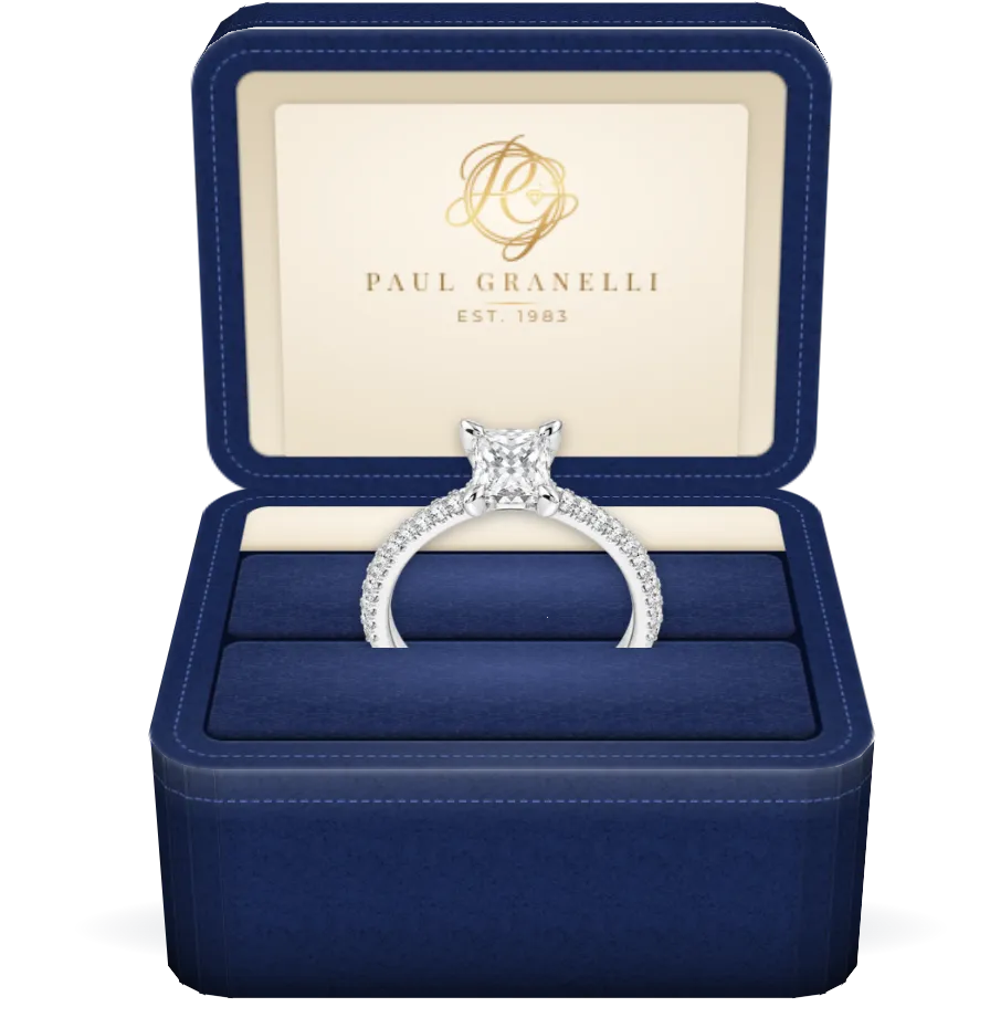 A princess-cut diamond solitaire engagement ring in a Paul Granelli ring box
